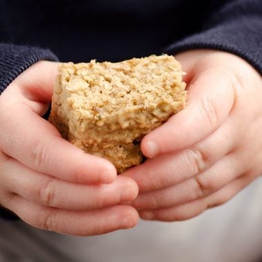 Toddler holding Kids No Sugar Peanut Butter Banana Oatmeal Bars