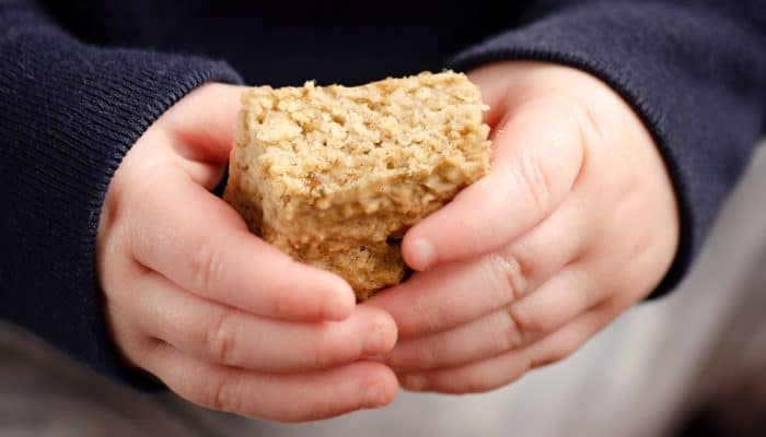 Toddler holding Kids No Sugar Peanut Butter Banana Oatmeal Bars