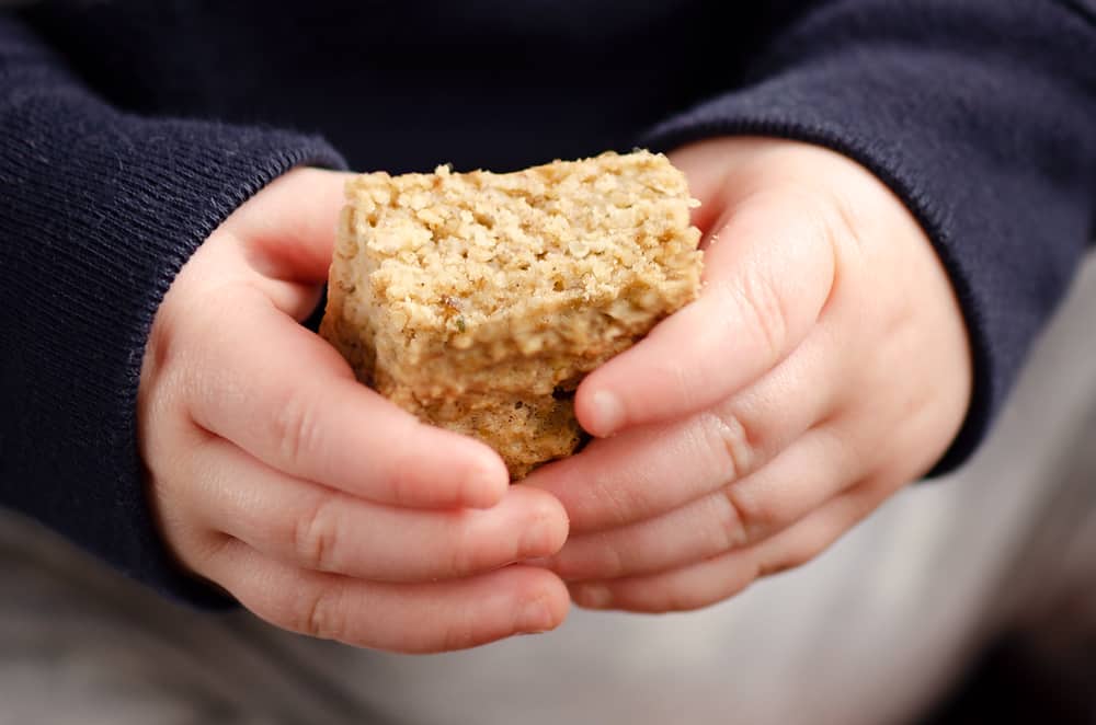 Toddler holding Kids No Sugar Peanut Butter Banana Oatmeal Bars