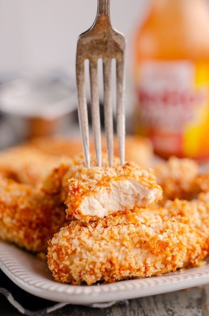 Air Fryer Buffalo Chicken Strips bite with fork