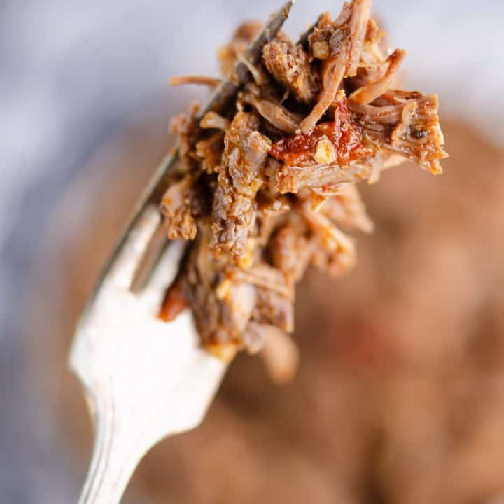 Chipotle Garlic Pressure Cooker Shredded Beef bite on fork