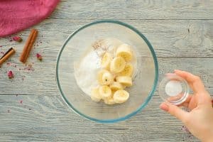 bananas and protein powder in bowl for pancake batter