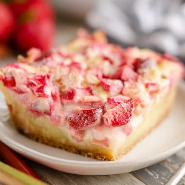 Strawberry Rhubarb Custard Dessert slice on plate