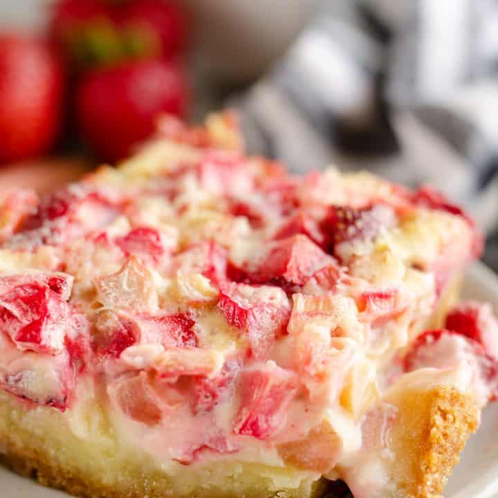 Strawberry Rhubarb Custard Dessert slice with bite on fork