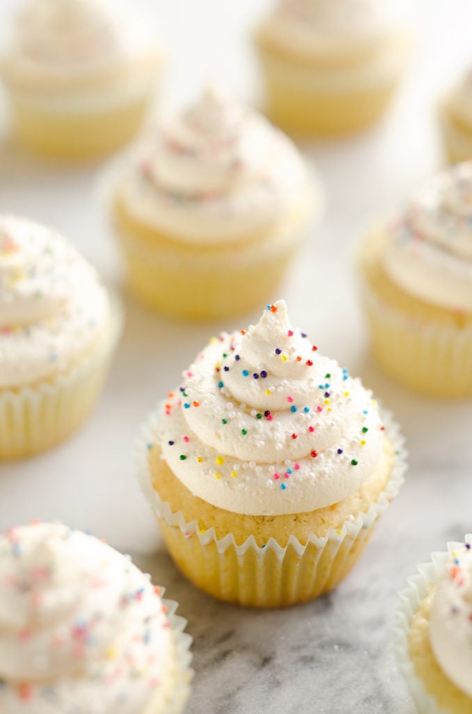 Best Birthday Cupcakes in paper liners on marble table