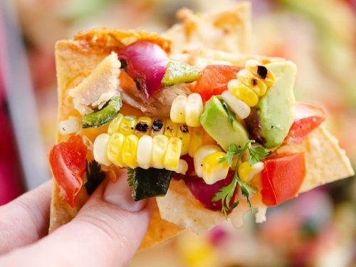 Avocado Corn Chicken Nachos chip full of toppings