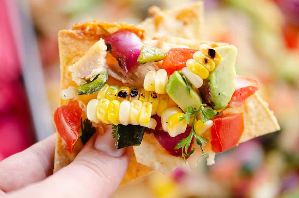 Avocado Corn Chicken Nachos chip full of toppings