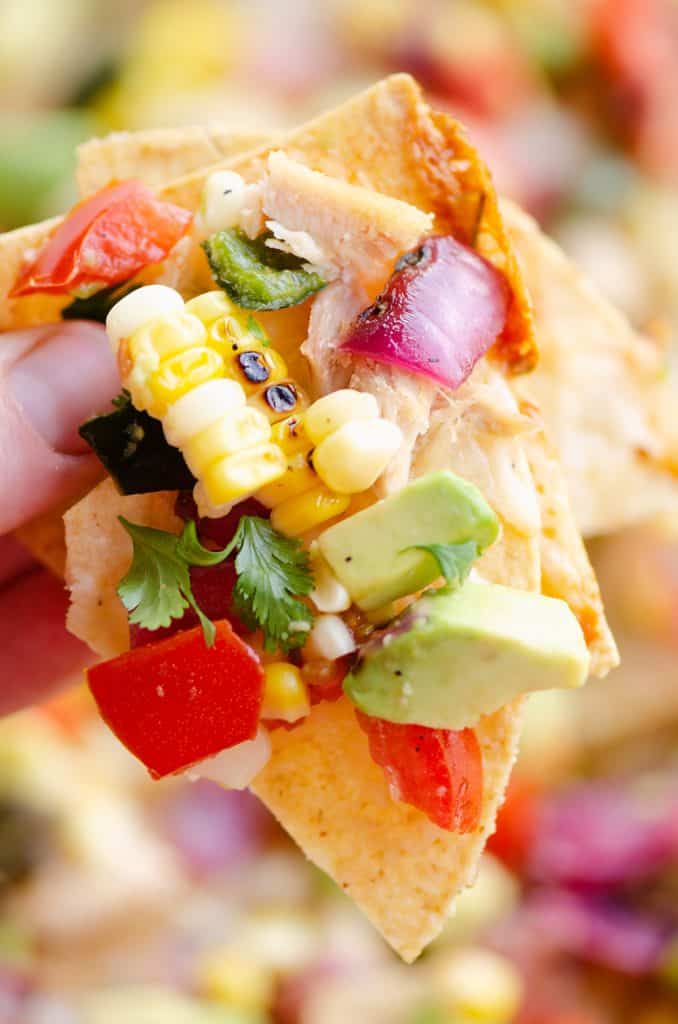 Avocado Corn Chicken Nachos chip full of toppings