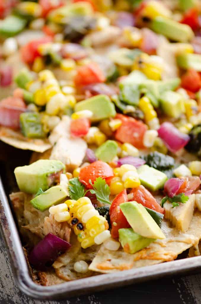 Avocado Corn Chicken Nachos cooked on sheet pan