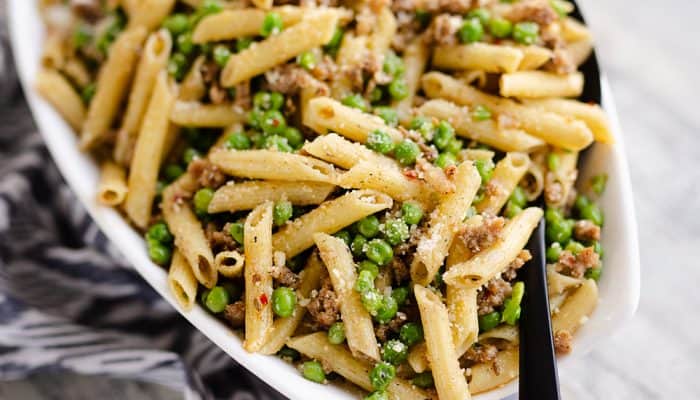 Brown Butter Sausage Penne Pasta served with large spoon