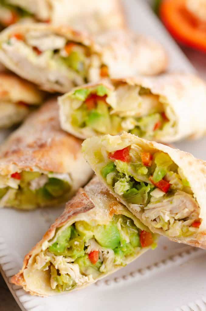 Air Fryer Avocado Chicken Egg Rolls sliced in half