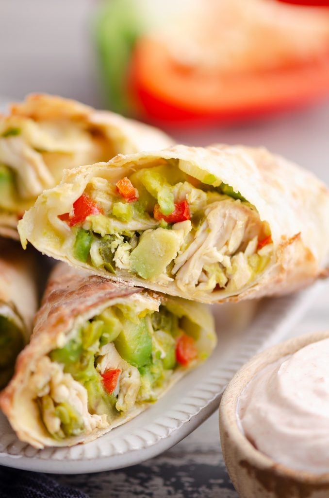 Air Fryer Avocado Chicken Egg Rolls served with dipping sauce