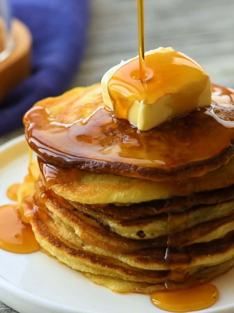 Best Buttermilk Pancake Recipe with pour of syrup