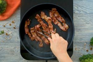 bacon frying in pan