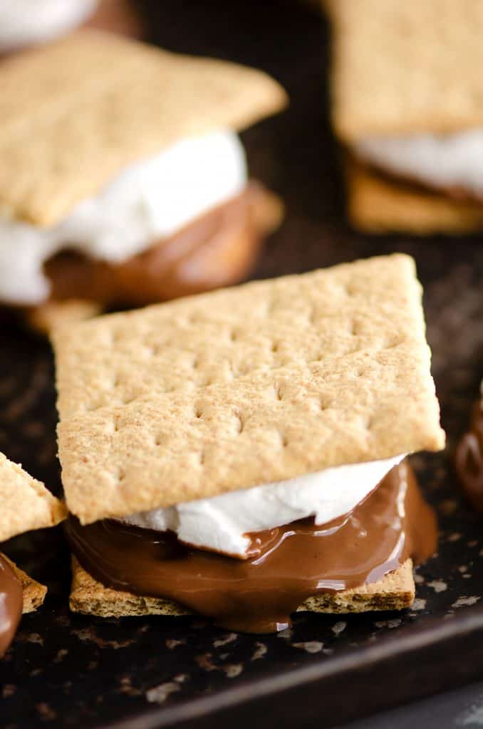 Peanut Butter Cup S'mores In The Oven with melted chocolate on sheet pan