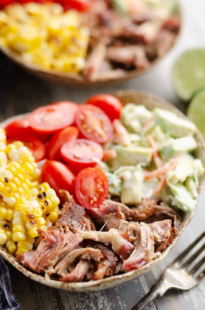 Pulled Pork Bowls with Avocado Slaw served on table