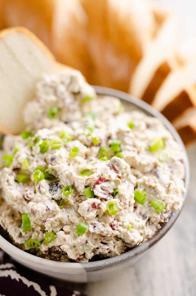 Cranberry Pecan Feta Dip with bread dipped in bowl