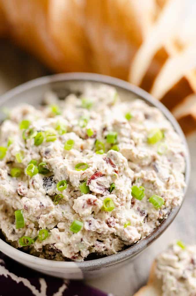 Cranberry Pecan Feta Dip in bowl with bread