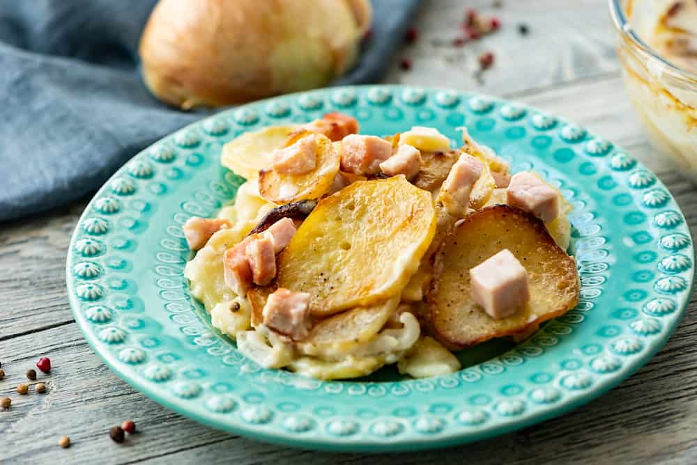 Scalloped Potatoes and Ham served on plate