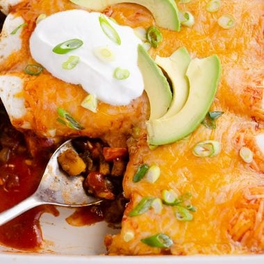 Black Bean & Squash Vegetarian Enchiladas scooped out of serving dish