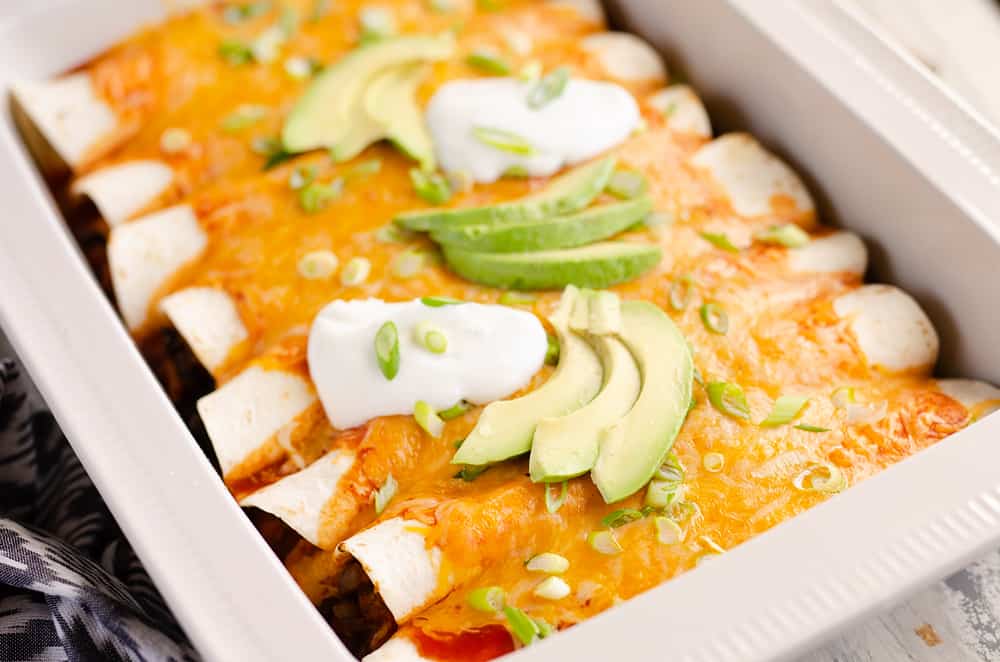 Black Bean & Squash Vegetarian Enchiladas served on dinner table