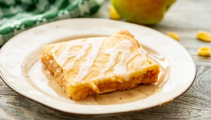 Glazed Apple Pie Bars square piece on plate
