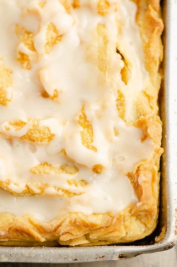 Glazed Apple Pie Bars in rimmed baking sheet