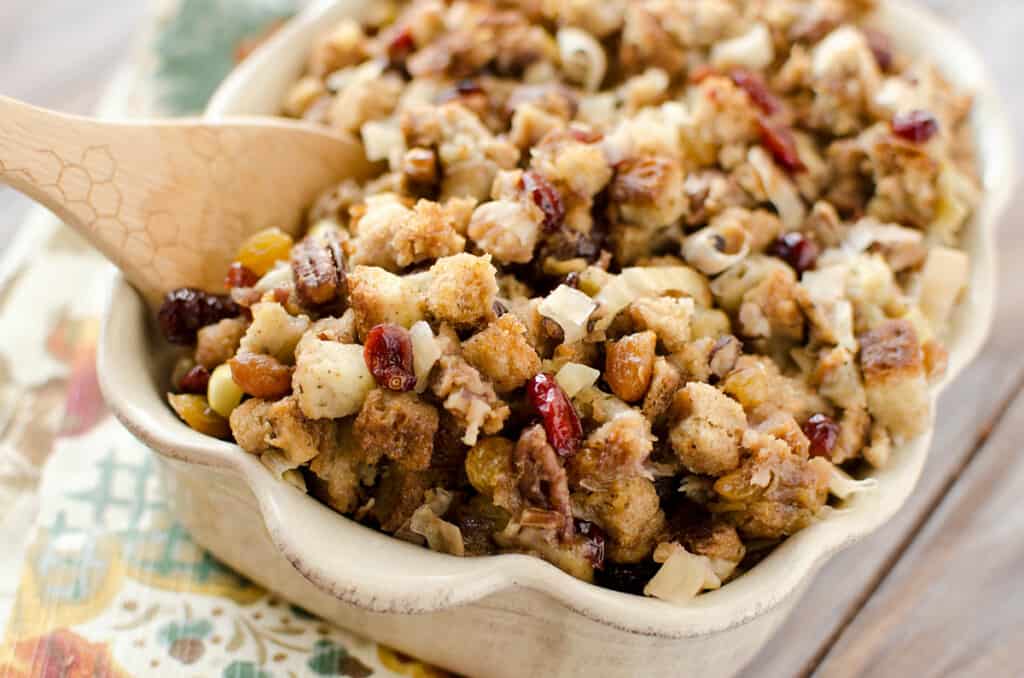 wooden spoon in dish of cranberry stuffing