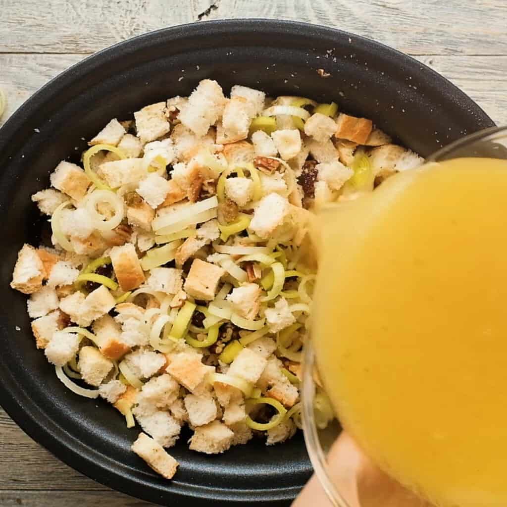 broth poured over stuffing in crock pot