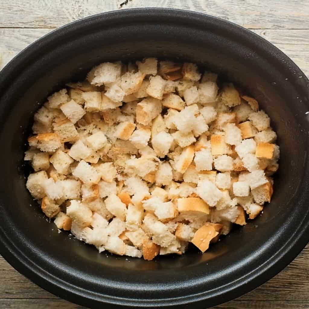 crock pot filled with bread cubes
