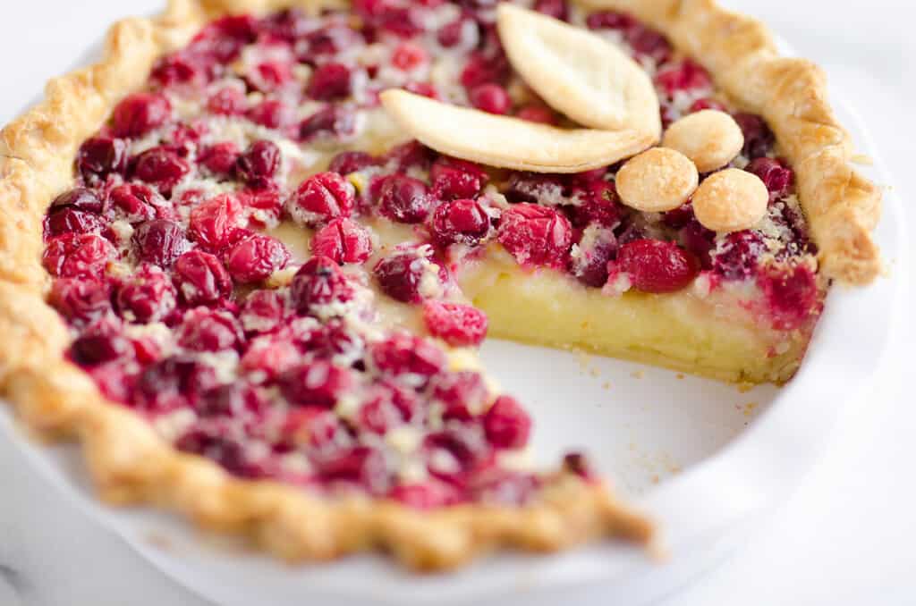 cranberry custard pie with slice removed from pie plate