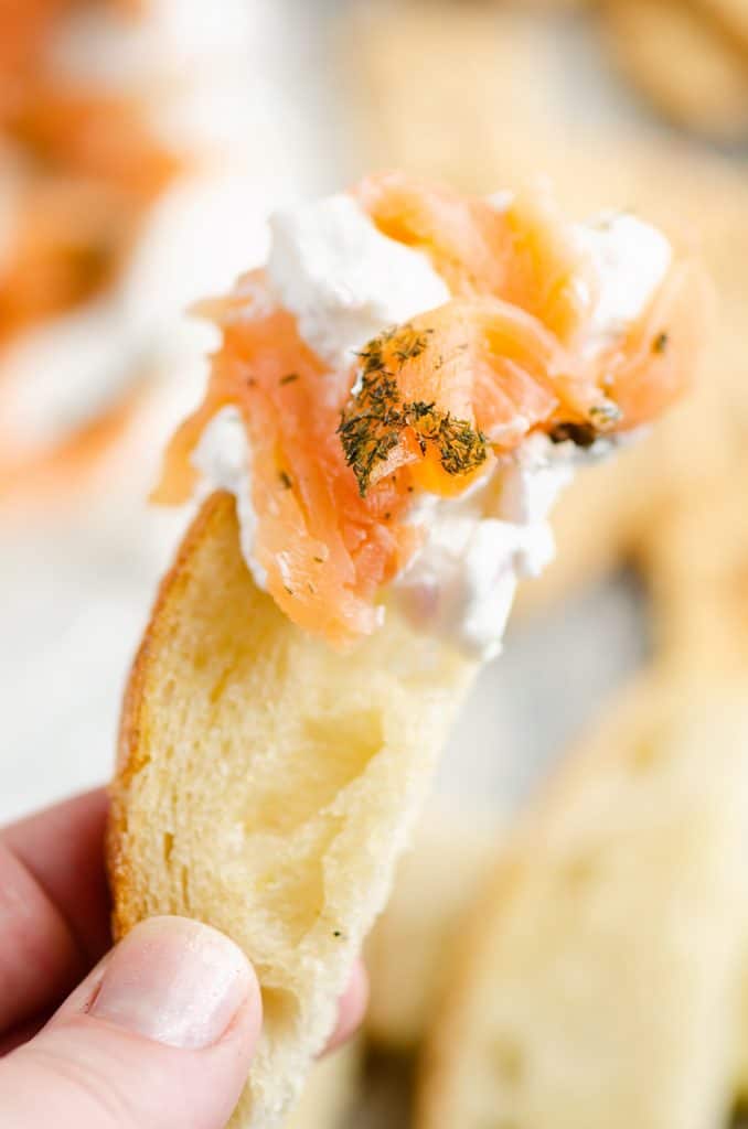 Smoked Salmon Cream Cheese Dip scooped on piece of bread