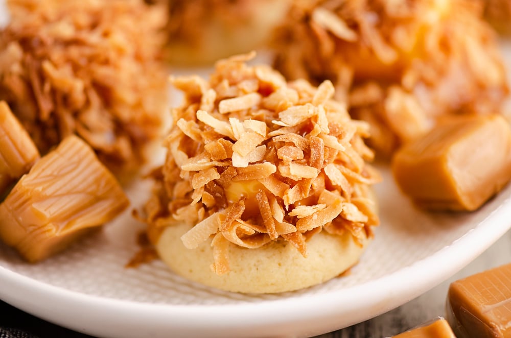 sugar cookie topped with caramel and toasted coconut