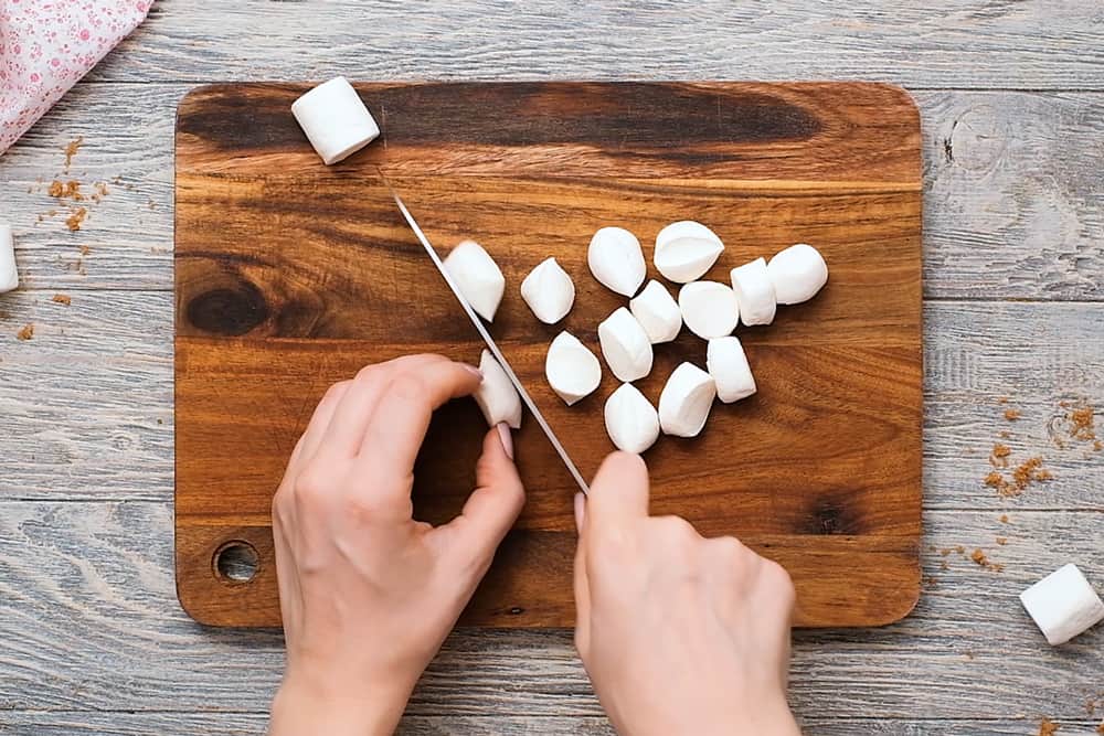 slicing marshmallows in half