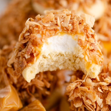 marshmallow coconut hat cookie with bite out of it on platter