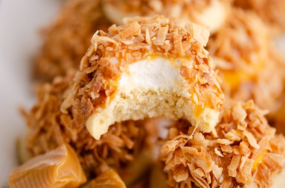 marshmallow coconut hat cookie with bite out of it on platter