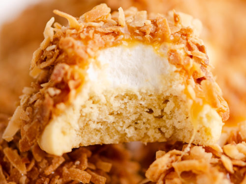 marshmallow coconut hat cookie with bite out of it on platter