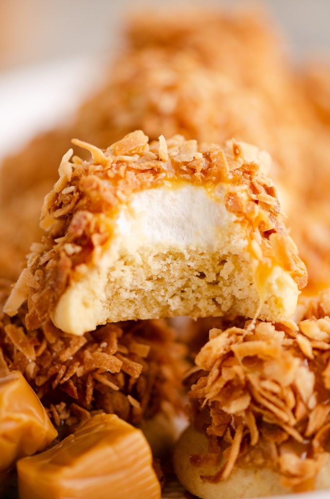 marshmallow coconut hat cookie with bite out of it on platter