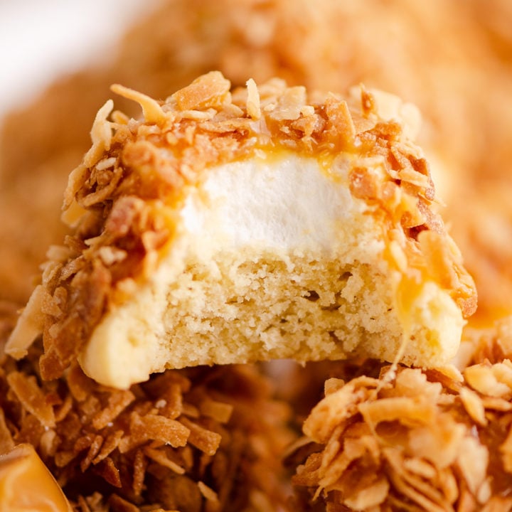 marshmallow coconut hat cookie with bite out of it on platter