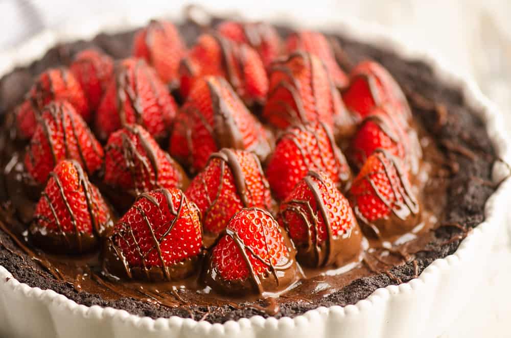 Chocolate Covered Strawberry Ganache Tart on table