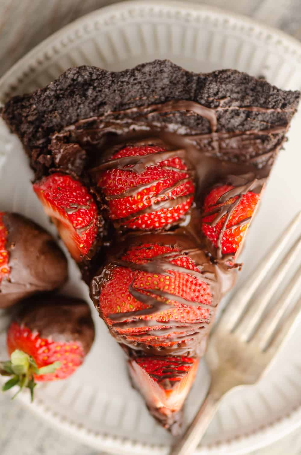 Chocolate Covered Strawberry Ganache Tart slice on plate