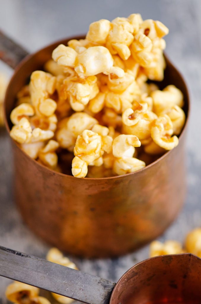 Microwave Caramel Popcorn in a measuring cup