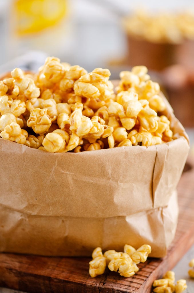 Microwave Caramel Popcorn in a brown paper bag on a table