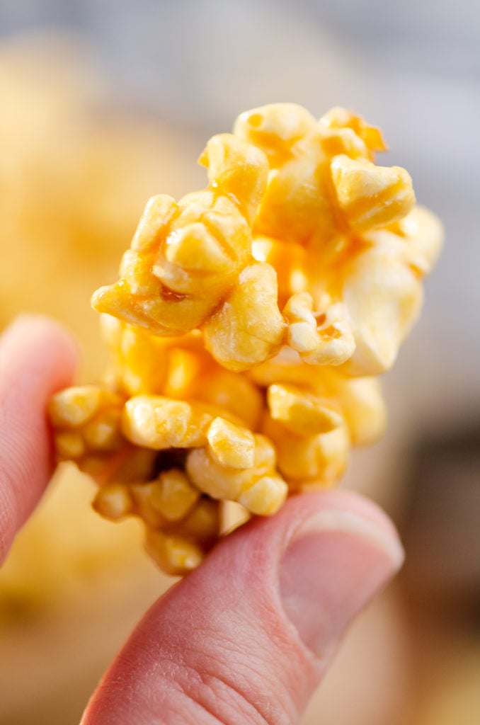 cluster of microwave Caramel Popcorn held in hands