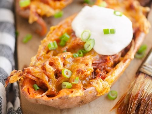 Cheesy BBQ Pork Sweet Potato Skins with sour cream