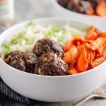 Glazed Hoisin Meatball Bowls served on table with fork