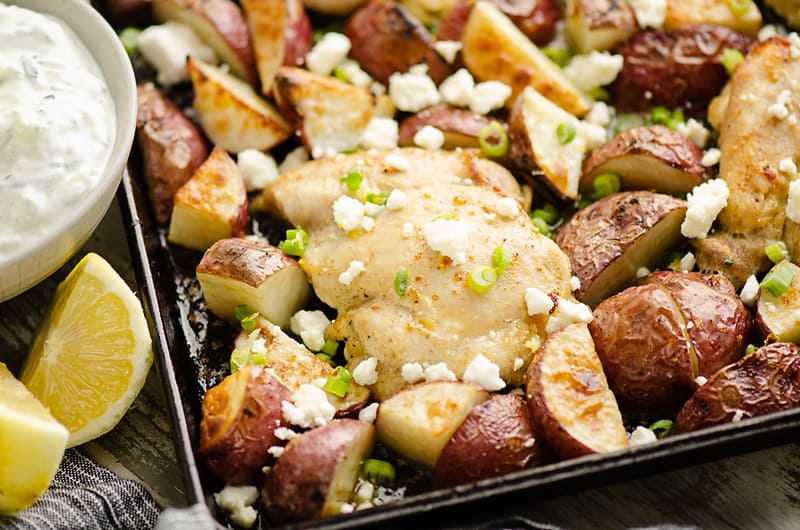 Lemon Feta Sheet Pan Chicken Thighs & Potatoes with yogurt sauce