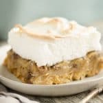 Sour Cream Raisin Meringue Bars served on table with fork