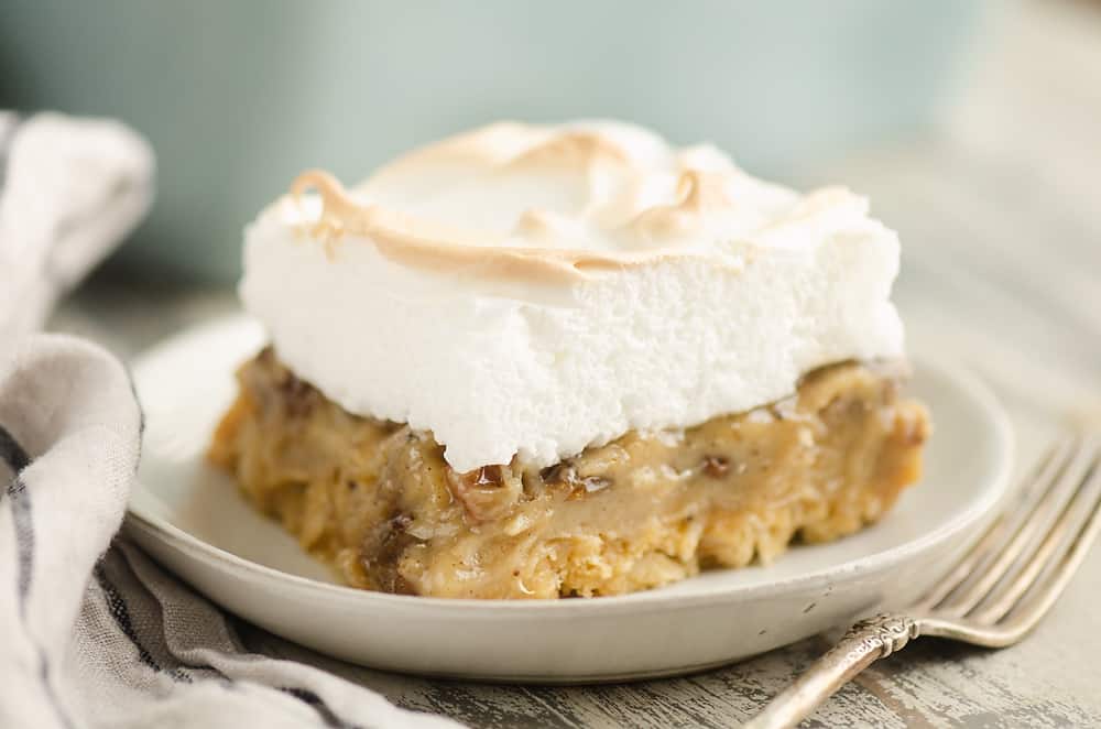 Sour Cream Raisin Meringue Bars served on table with fork