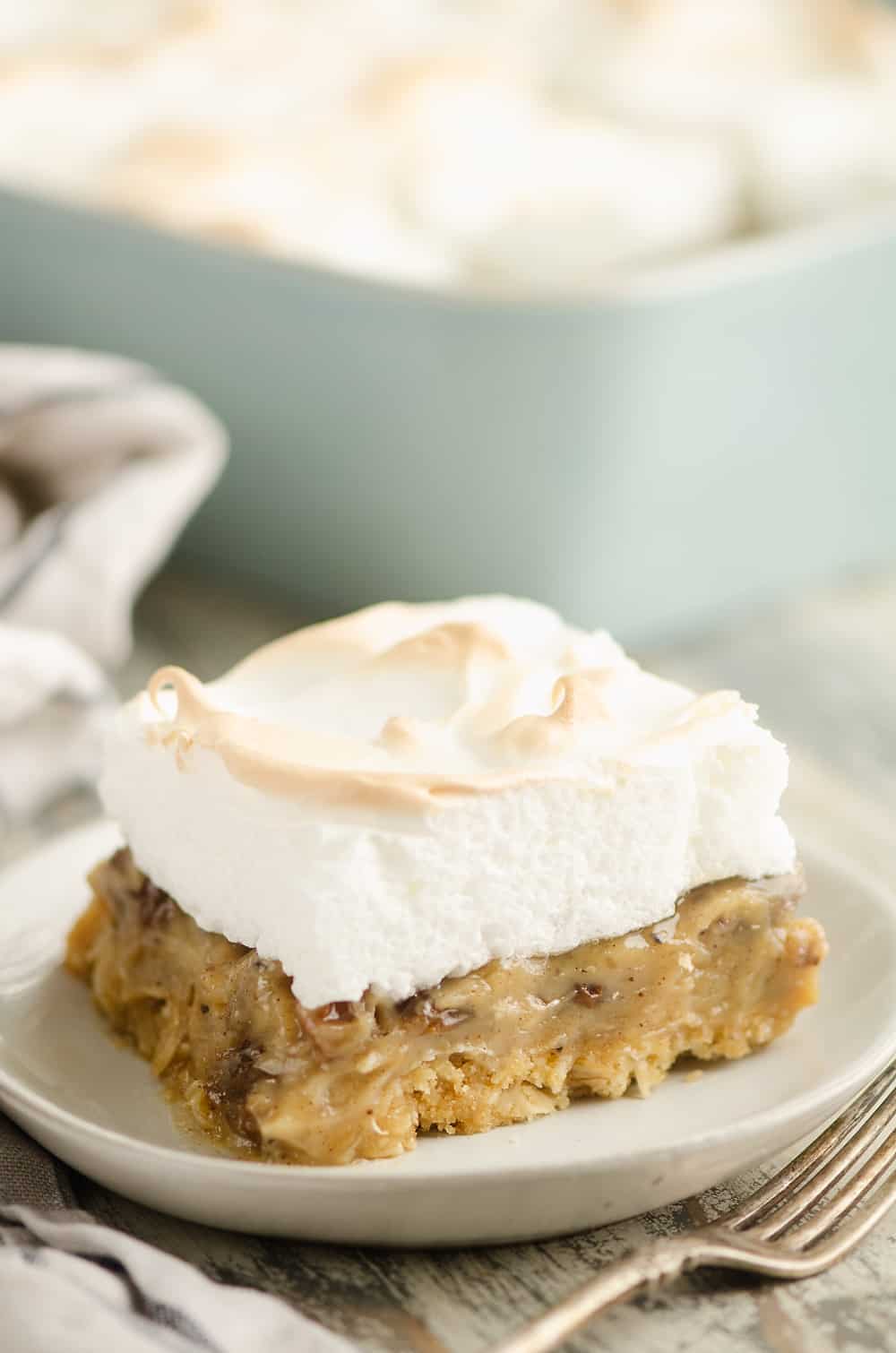 Sour Cream Raisin Meringue Bars on plate with fork